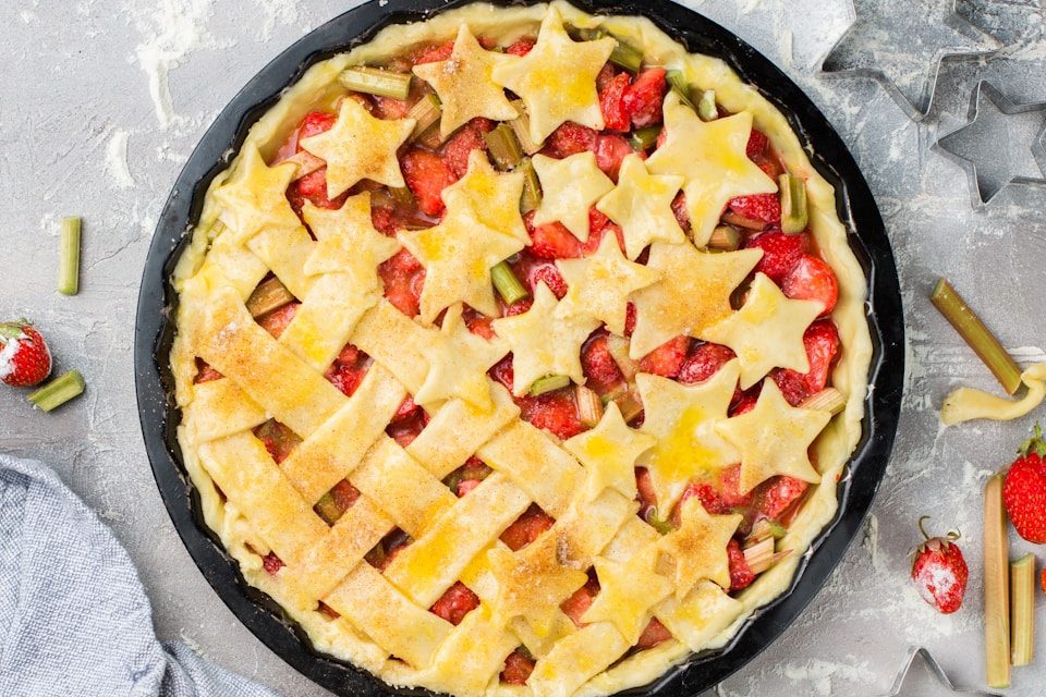 Homemade strawberry rhubarb pie with decorative lattice and star-shaped crust topping prepared for Charleston dessert catering.