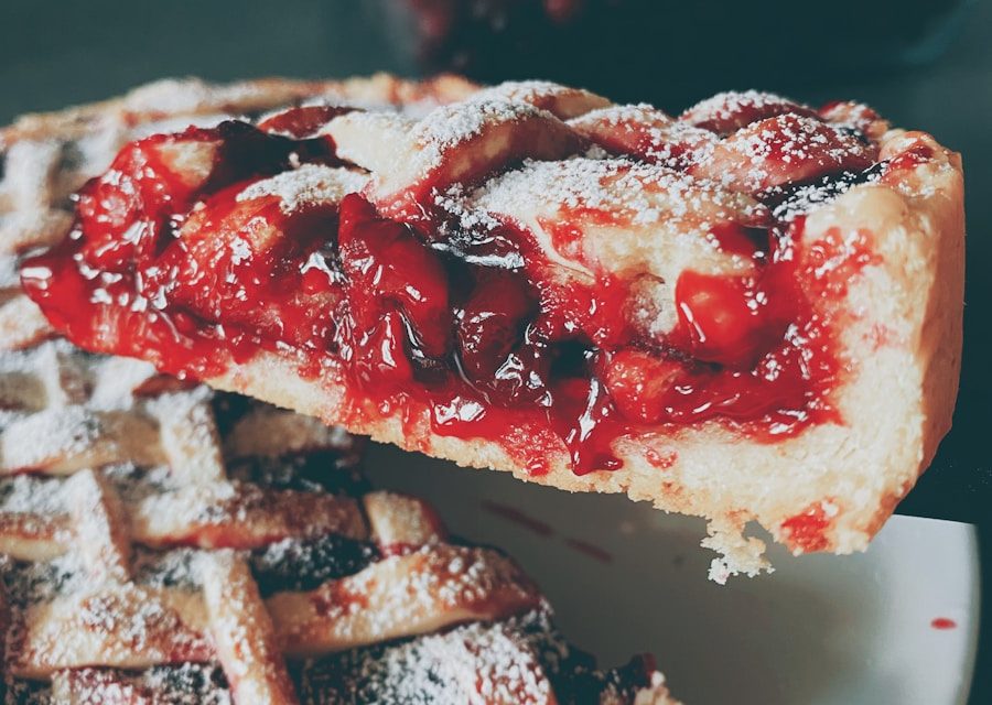 Homemade cherry lattice pie dusted with powdered sugar, featuring a flaky buttery crust and sweet cherry filling, perfect for catered dessert tables in Charleston, SC.