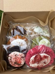 Assorted gourmet cookies packaged in a gift box featuring specialty flavors, decorated cookies, and seasonal favorites.