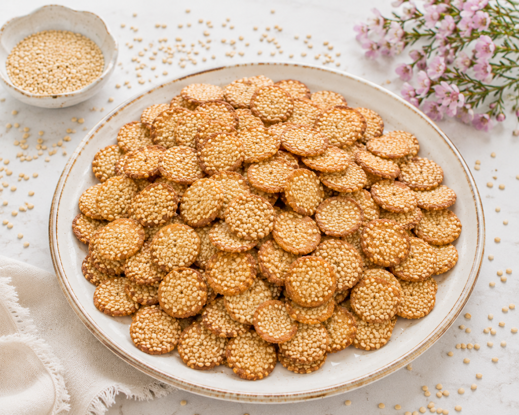 Traditional Charleston benne wafer sesame cookies made with toasted sesame seeds and arranged on a serving platter.